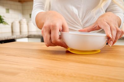 Lifestyle_No_Slip_Suction_Bowl_On_Counter_Pull_Tab_Yellow_Front - Babies and Moms in Cyprus